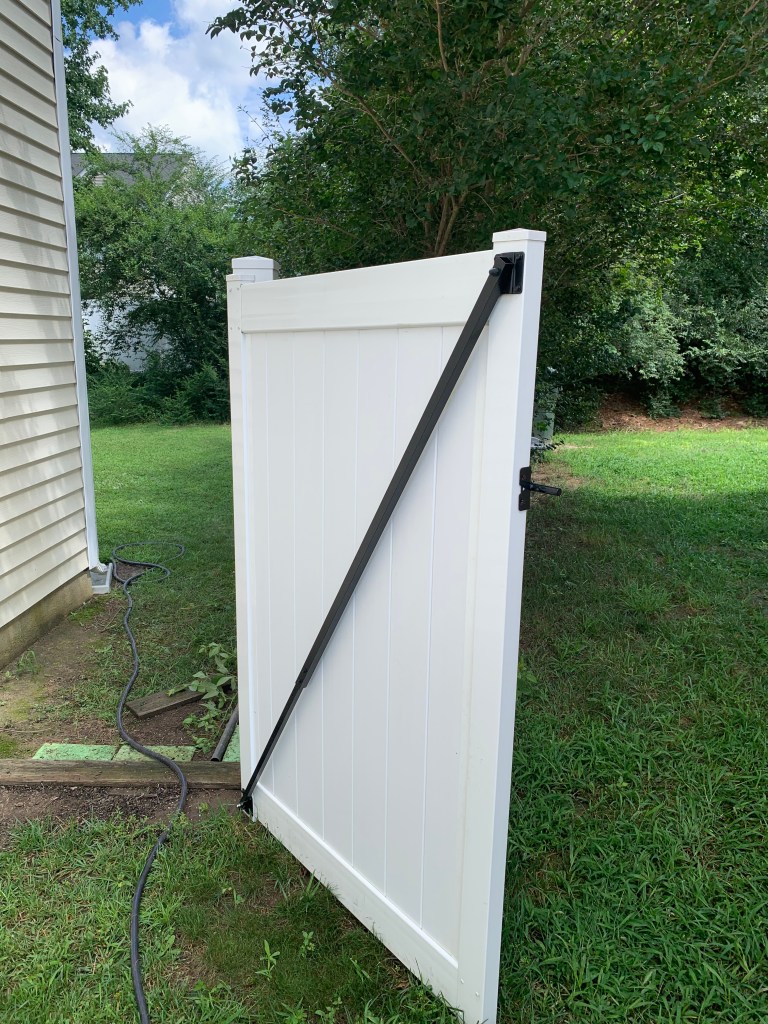 Check It Off Handyman pressure washed back fence for bright and clean backyard in Raleigh, NC