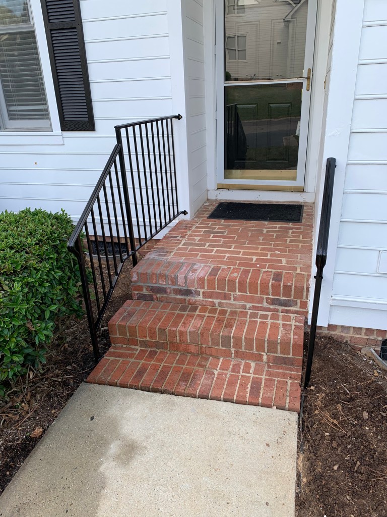 Check It Off Handyman in Apex repaired brick porch steps and painted and reinstalled handrails.