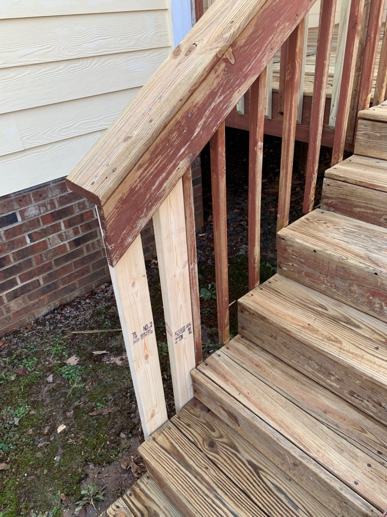 Newly replaced porch handrail boards ready for staining in Raleigh, NC